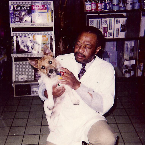 Throwback picture of Veterinarian Dr. Jerome B. Williams with a dog